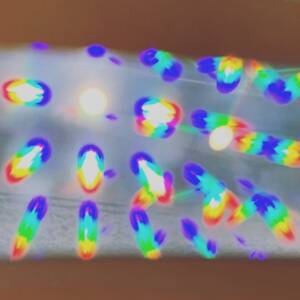 multiple small rainbows as seen through diffraction grating